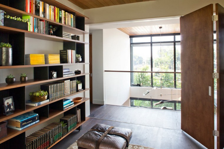 The Adelaide Midcentury Modern House is one of Ray Kappe’s prefab Livinghomes that’s made up of 11 modules installed on a beautiful lot in Santa Monica over the course of just two days. With a focus on indoor/outdoor living, the design is split over multiple levels that help define certain areas while remaining open and light. Complementing the home’s style are the warm, modern interiors that were designed by DKD LTD.