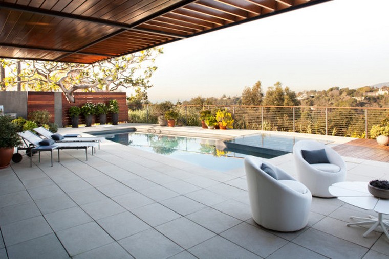 The Adelaide Midcentury Modern House is one of Ray Kappe’s prefab Livinghomes that’s made up of 11 modules installed on a beautiful lot in Santa Monica over the course of just two days. With a focus on indoor/outdoor living, the design is split over multiple levels that help define certain areas while remaining open and light. Complementing the home’s style are the warm, modern interiors that were designed by DKD LTD.