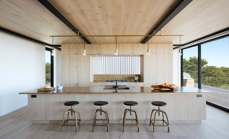 1-6 Hamptons home by Bates Masi features cantilevering upper floor